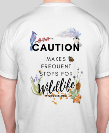 off white T-shirt that reads Caution Makes Frequent stops for Wildlife wildones.org includes native flora, pollinators, and birds.