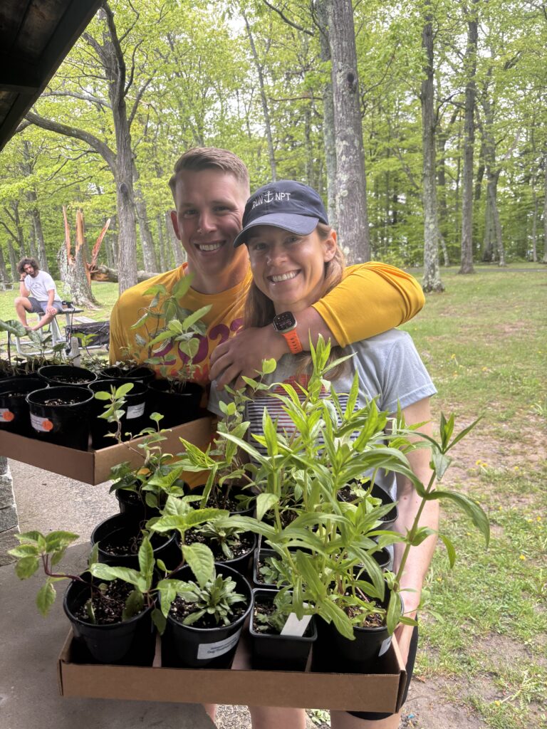 Happy gardeners with their new plants at the 2025 Thacher Native Plant Sale.